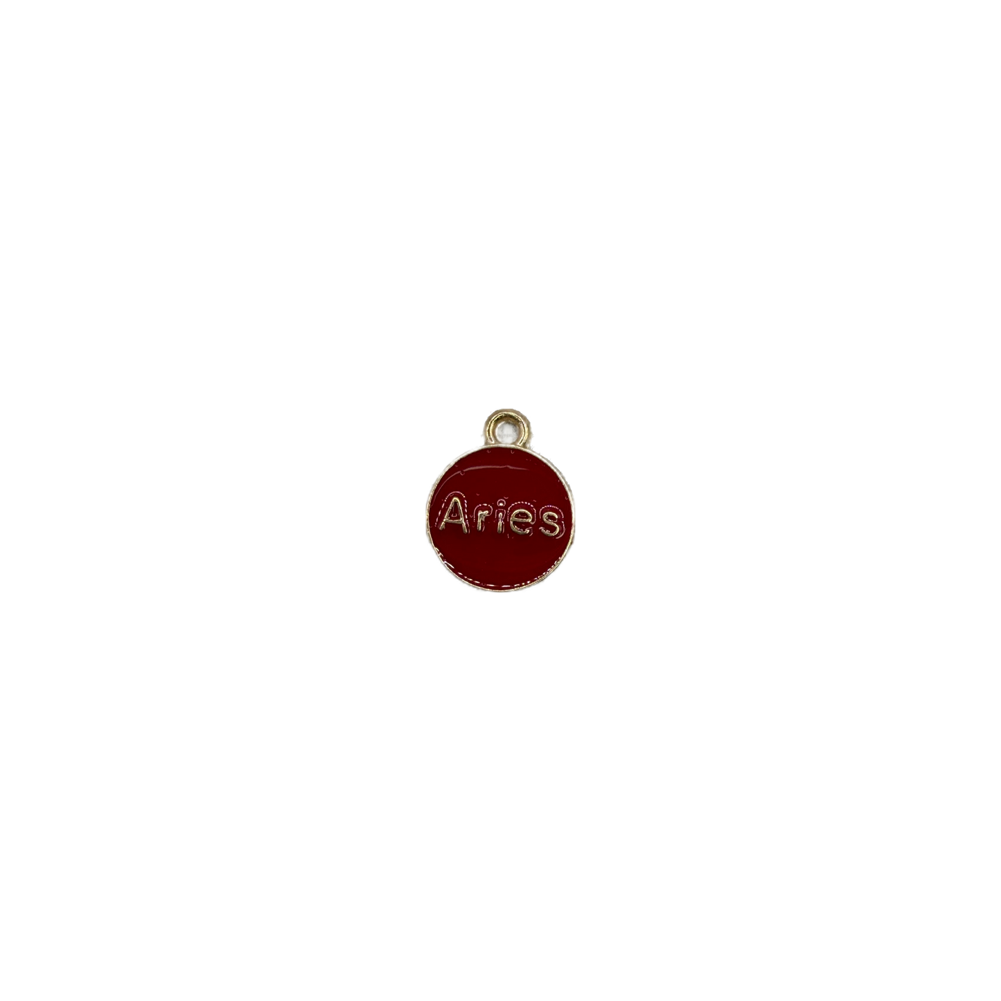 Red Aries zodiac disc with raised gold lettering and clear gem