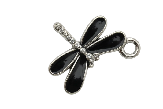 Glossy black dragonfly charm with silver-tone outline on black background