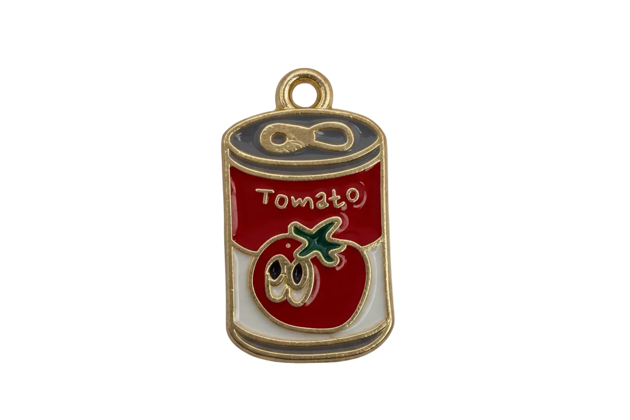 Red and white tomato soup can charm with gold outline, green stem detail, and small clear gem accent