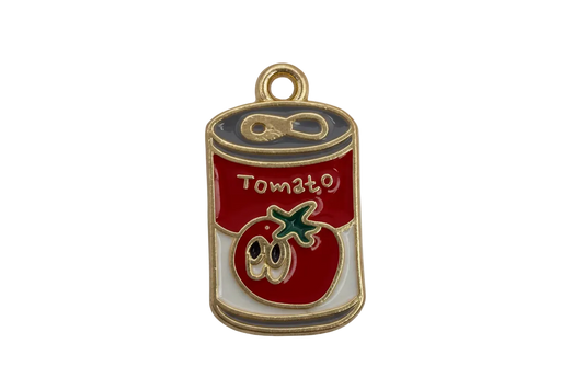 Red and white tomato soup can charm with gold outline, green stem detail, and small clear gem accent