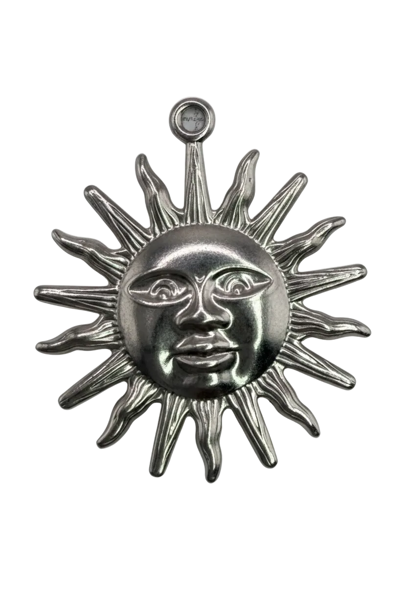 Silver sun face with sculpted rays and a small clear gem accent