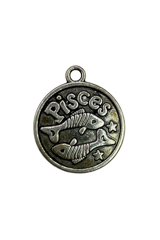 Antiqued silver Pisces coin with two fish, stars, and raised Pisces lettering