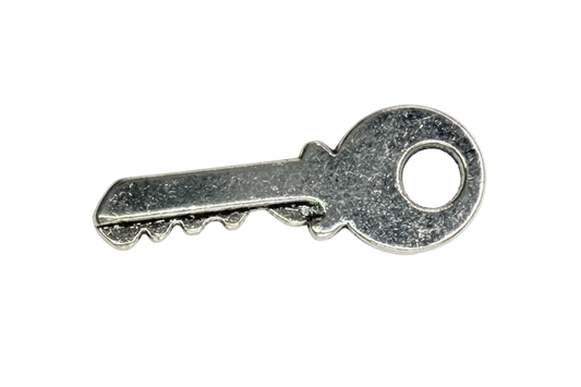 Silver key charm with textured finish and round bow detail