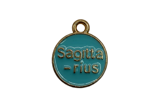 Round teal enamel disc with raised gold lettering and gold border