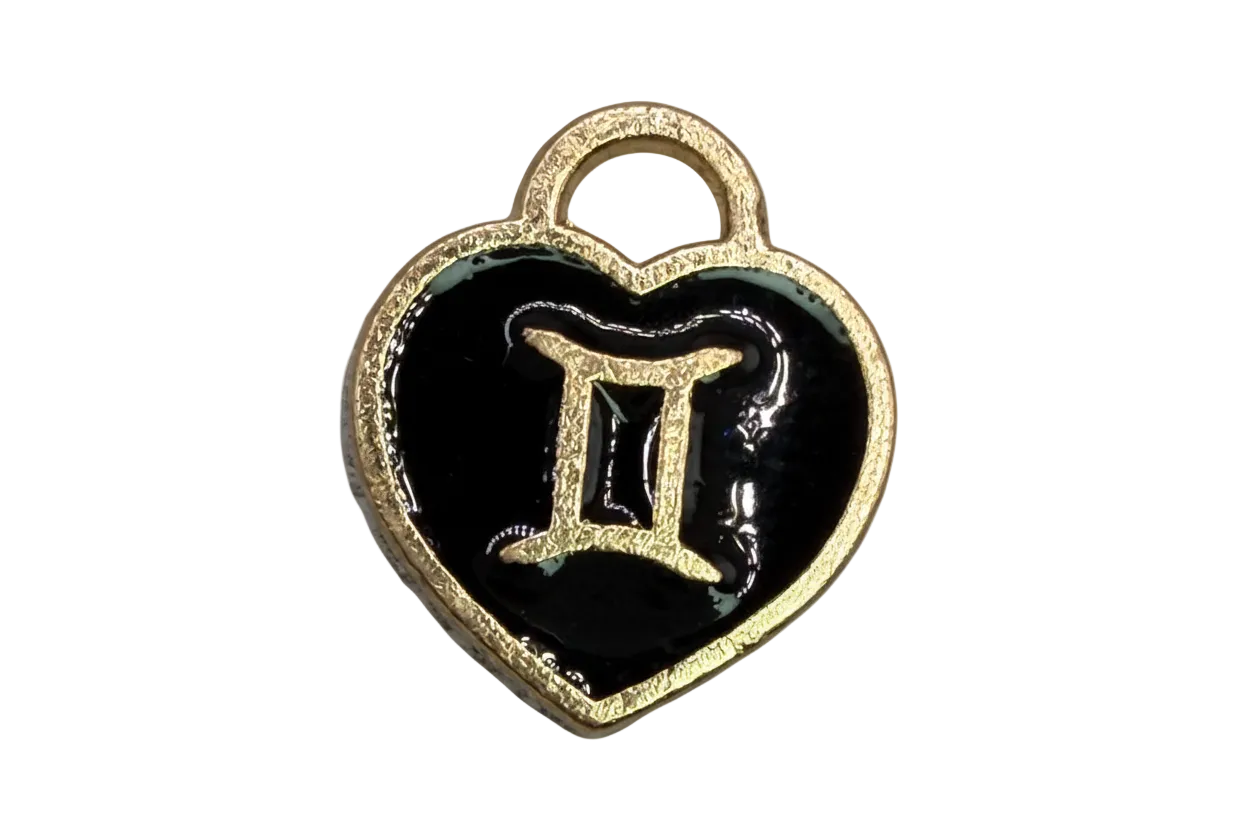 Black enamel heart with gold Gemini symbol and small white stone accent