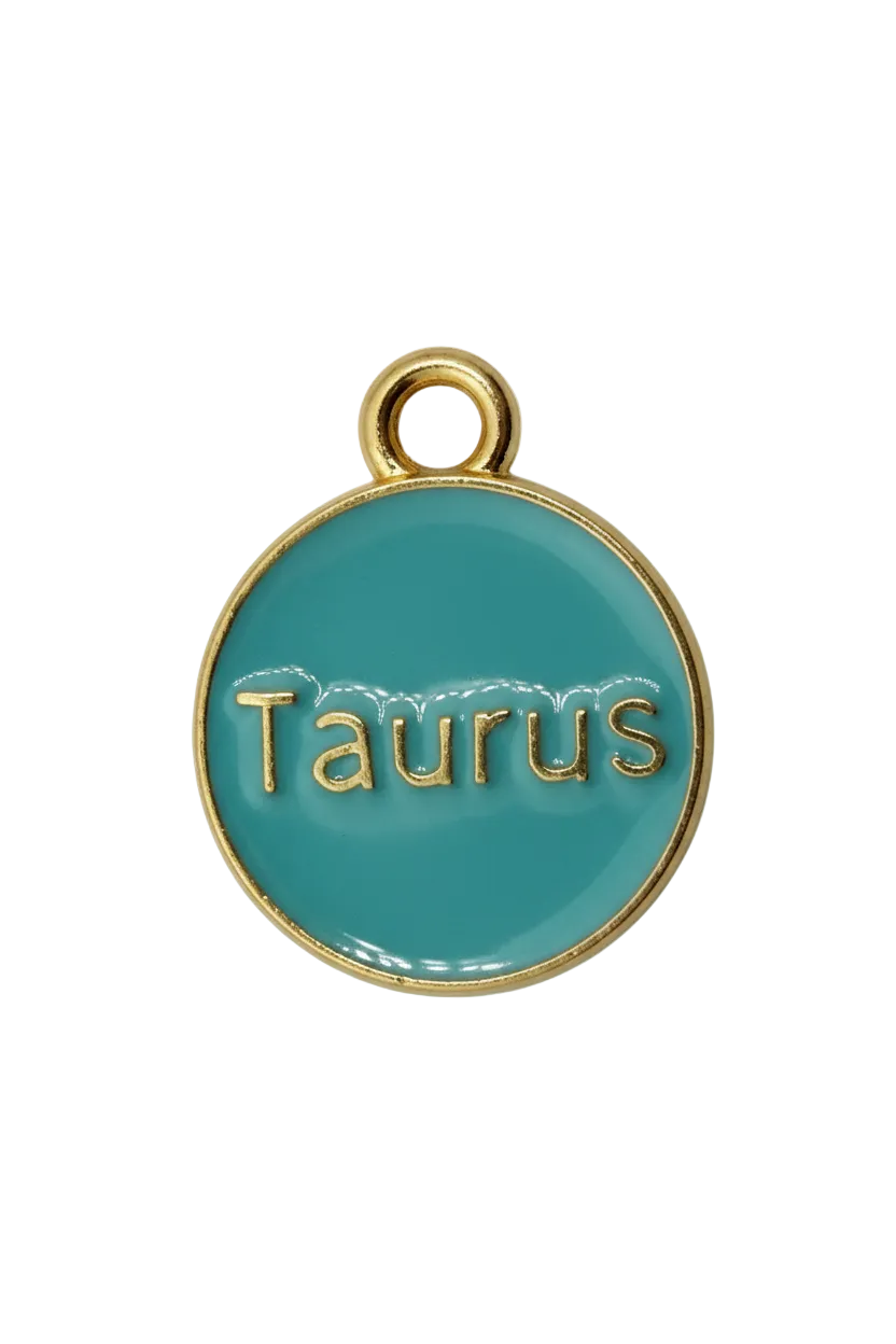 Teal round Taurus zodiac medallion with raised gold lettering and a small white gem accent