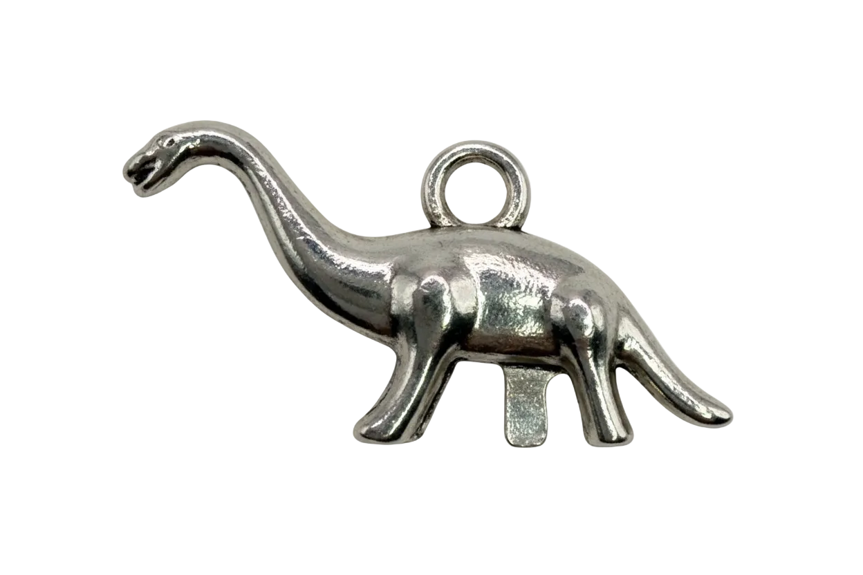 Polished silver elephant silhouette charm with raised trunk, sculptural profile on black background