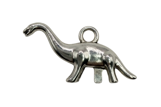 Polished silver elephant silhouette charm with raised trunk, sculptural profile on black background