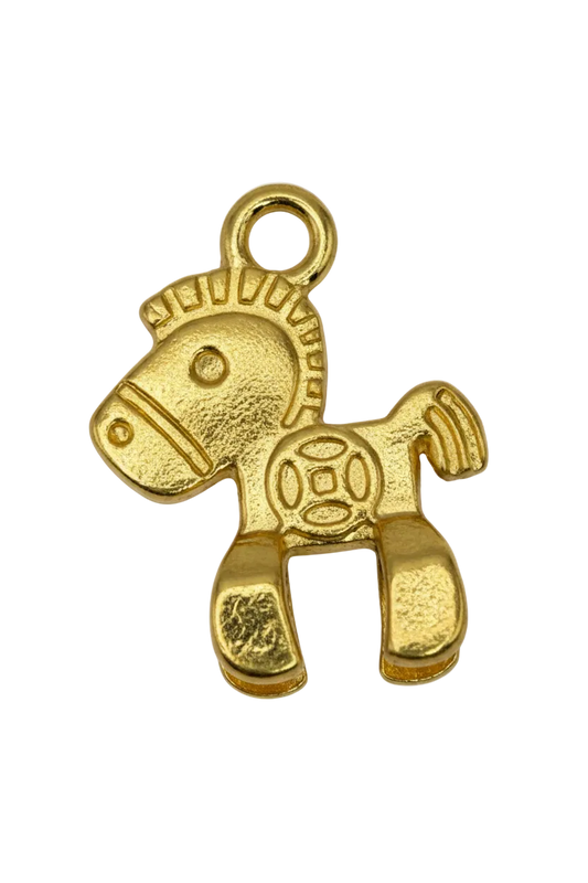 Textured gold hieroglyph-style symbol with sculpted abstract figure and stylized face