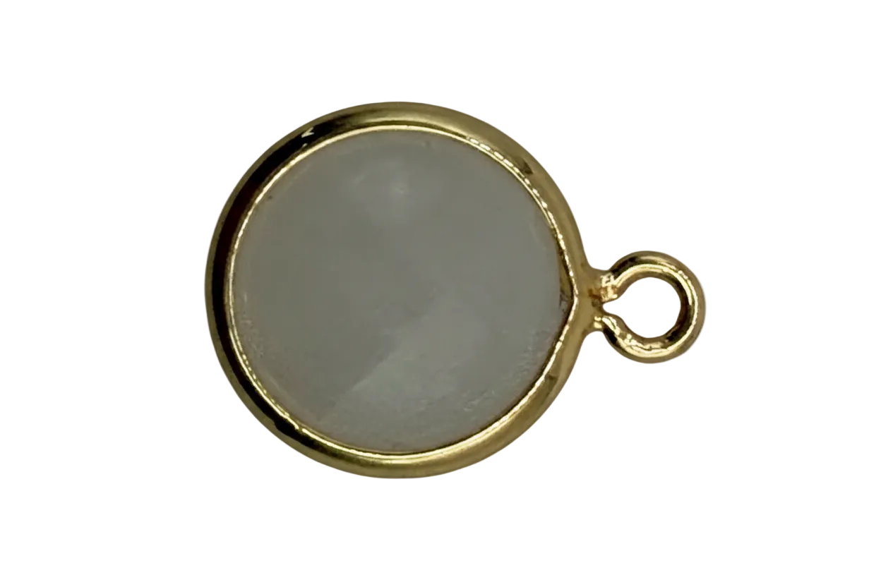Round soft-gray inlay disc framed in polished gold with a small marbled accent