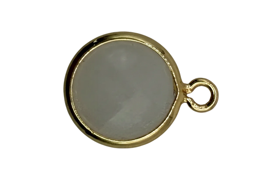 Round soft-gray inlay disc framed in polished gold with a small marbled accent