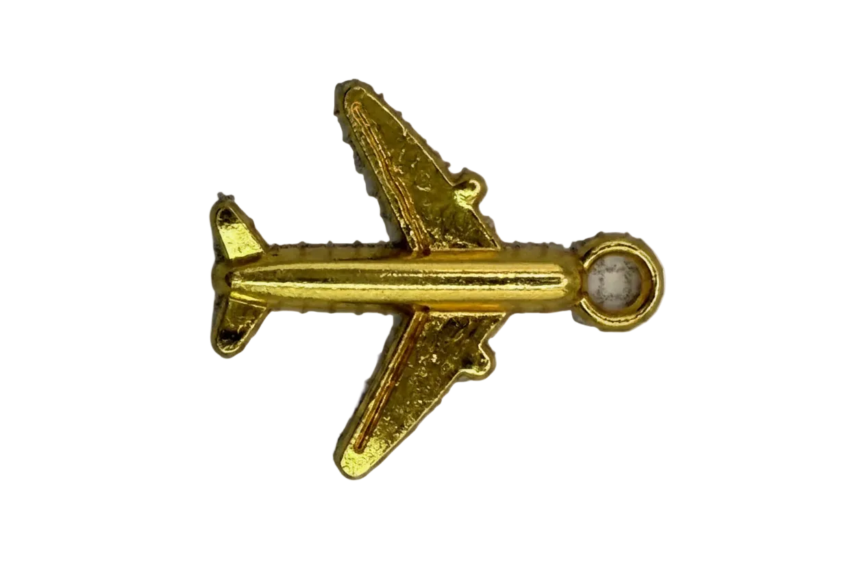 Gold airplane charm with a small clear gem accent at the nose