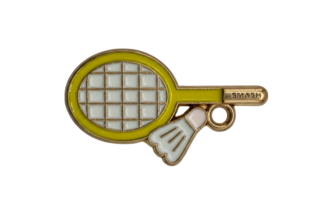 Gold badminton racket with yellow rim, gray grid, and white shuttlecock accent on black background