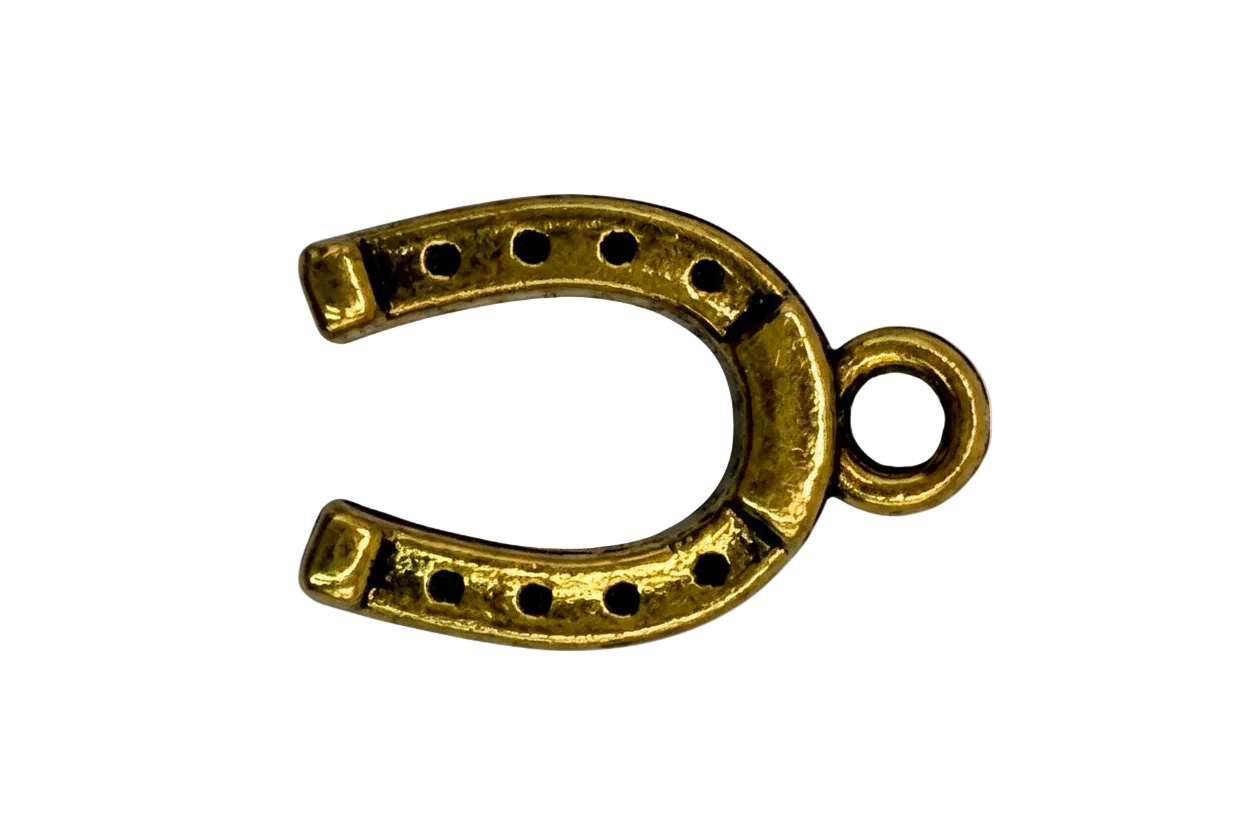 Gold horseshoe charm with dotted cutouts and antiqued detailing