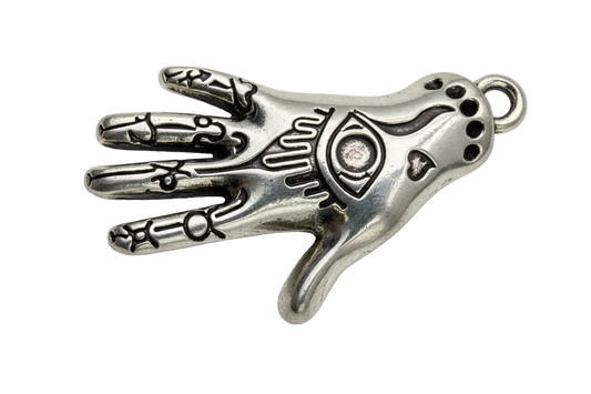 Polished silver hamsa hand with engraved eye motif and oxidized black detailing