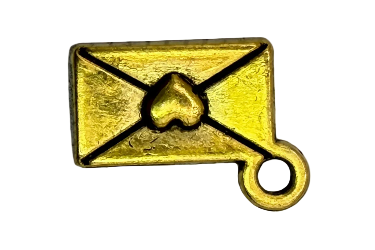 Gold envelope with black outline, raised heart seal, and small clear gem accent