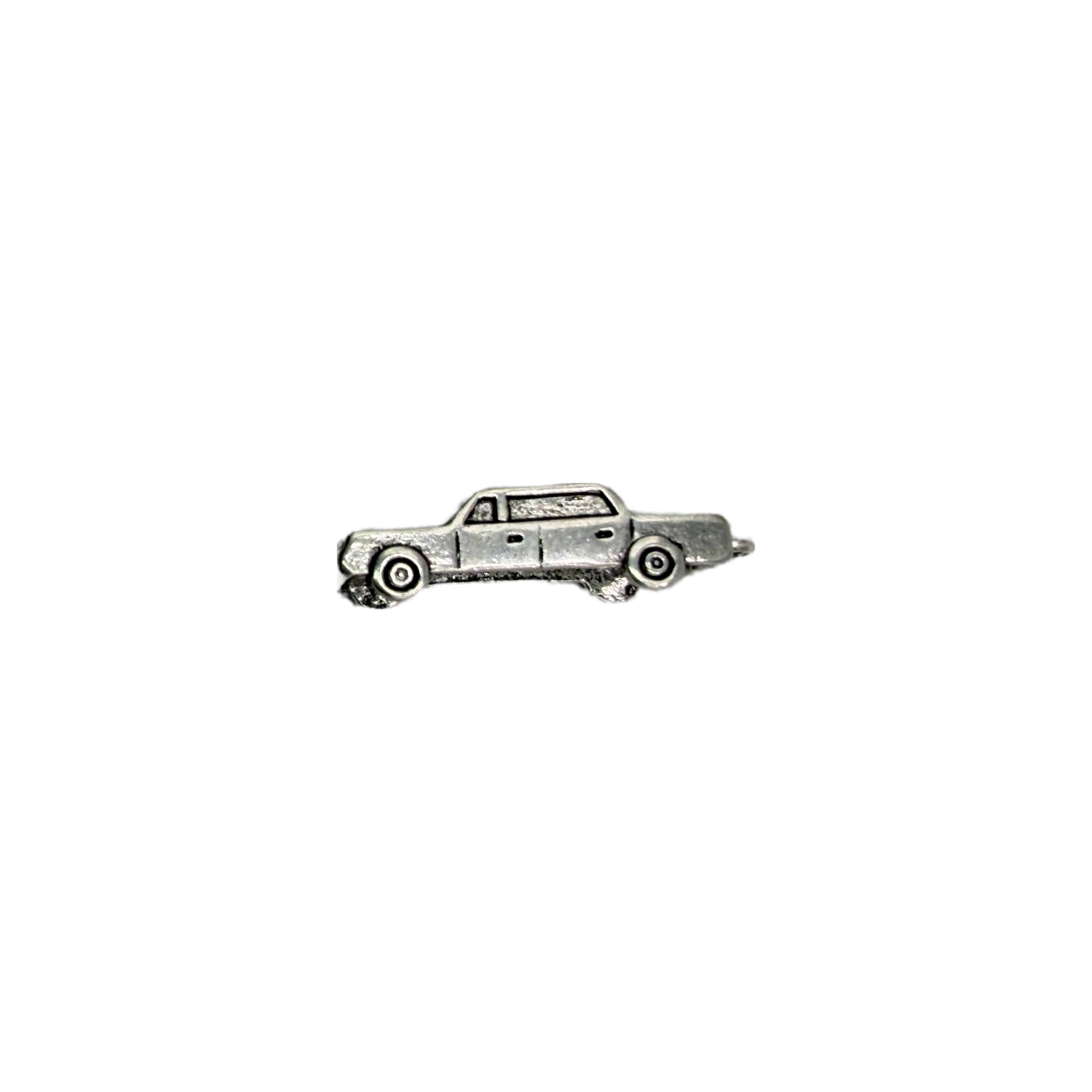 Silver-tone upside-down car with engraved wheel details