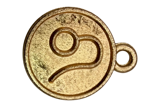 Round gold medallion charm with embossed music note motif and textured satin finish
