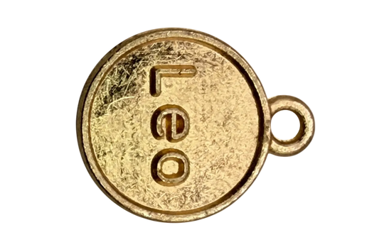 Gold round coin charm with embossed Leo lettering and textured antique-style finish