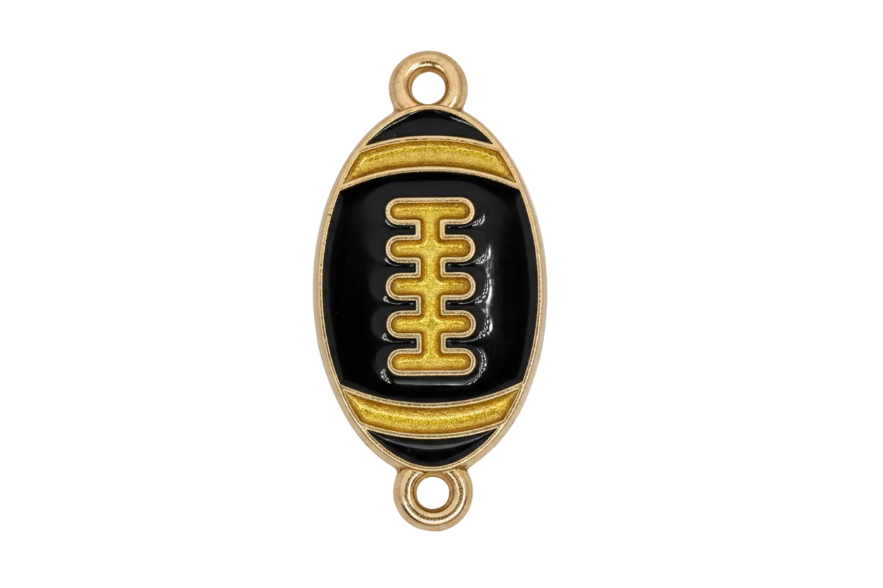 Glossy black enamel football with gold detailing