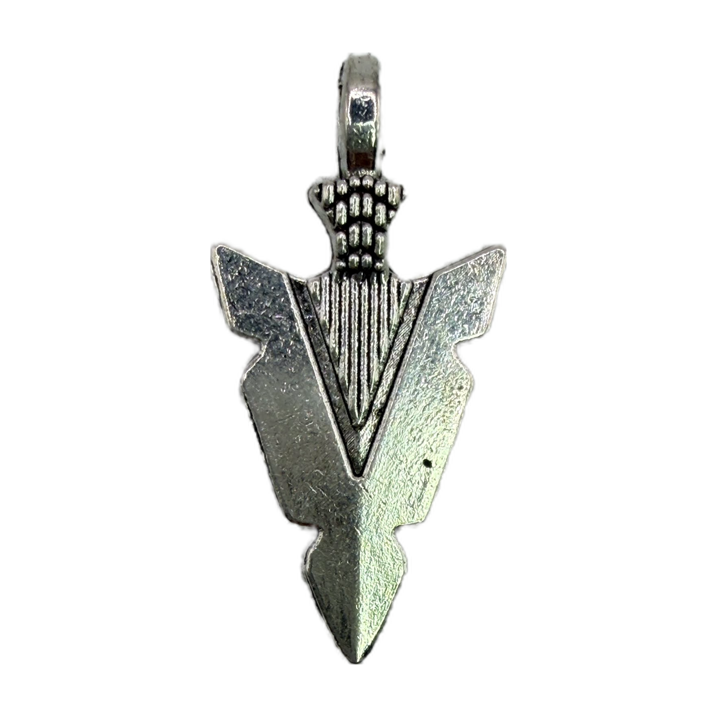 Silver arrowhead pendant with engraved center and oxidized texture on black background