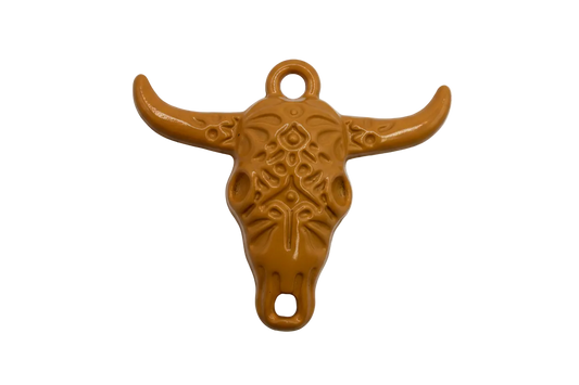 Caramel-brown longhorn skull charm with embossed tooled pattern, gold-toned metal base