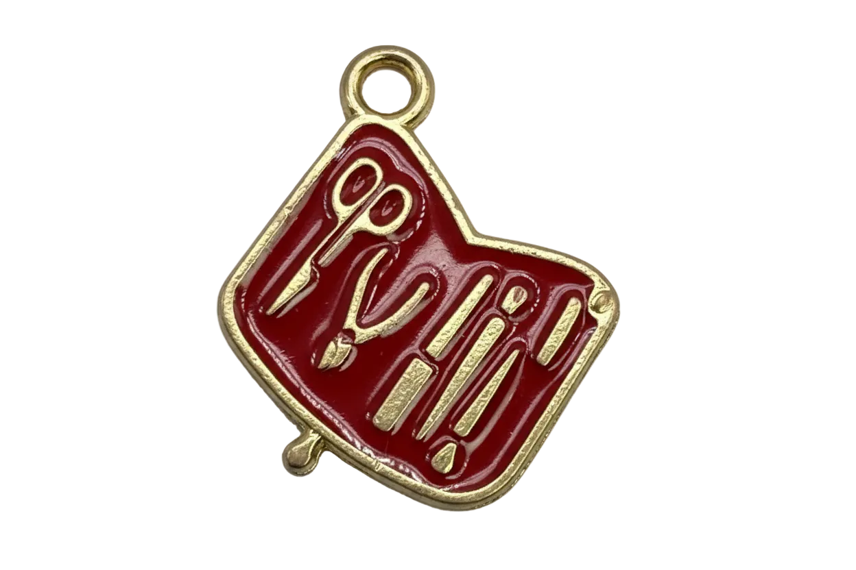 Glossy red enamel manicure tools tag with gold detailing