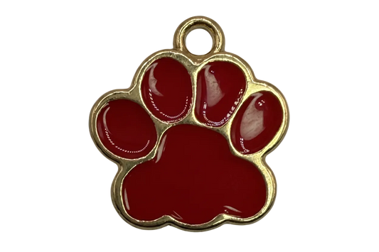 Gold-framed red enamel paw print charm with glossy finish