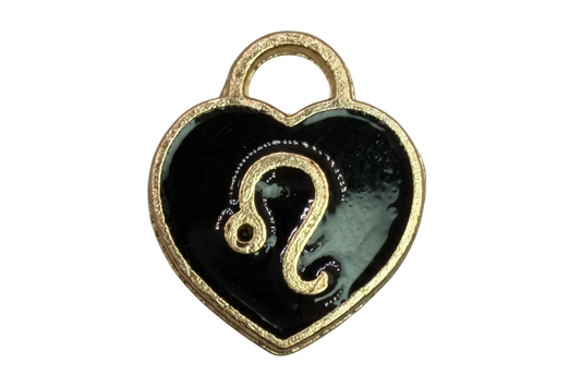 Glossy black heart with raised gold question mark and textured gold edge
