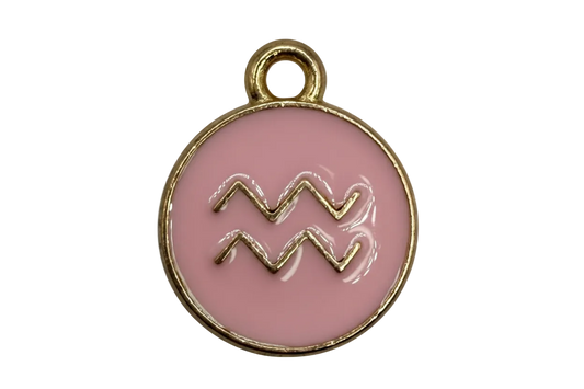 Blush pink round enamel Aquarius zodiac disc with raised gold symbol and gold border