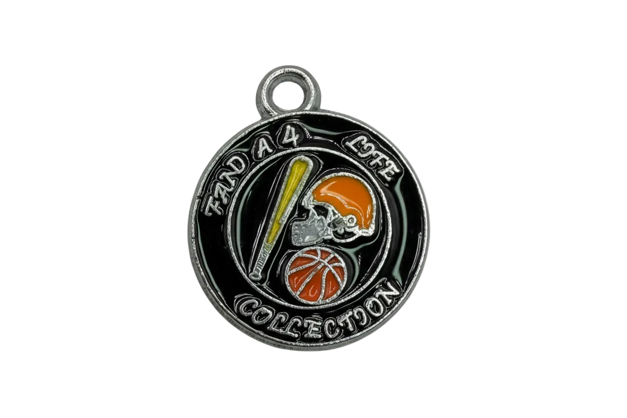 Round black enamel sports medallion with silver text and orange helmet, orange basketball, and yellow bat