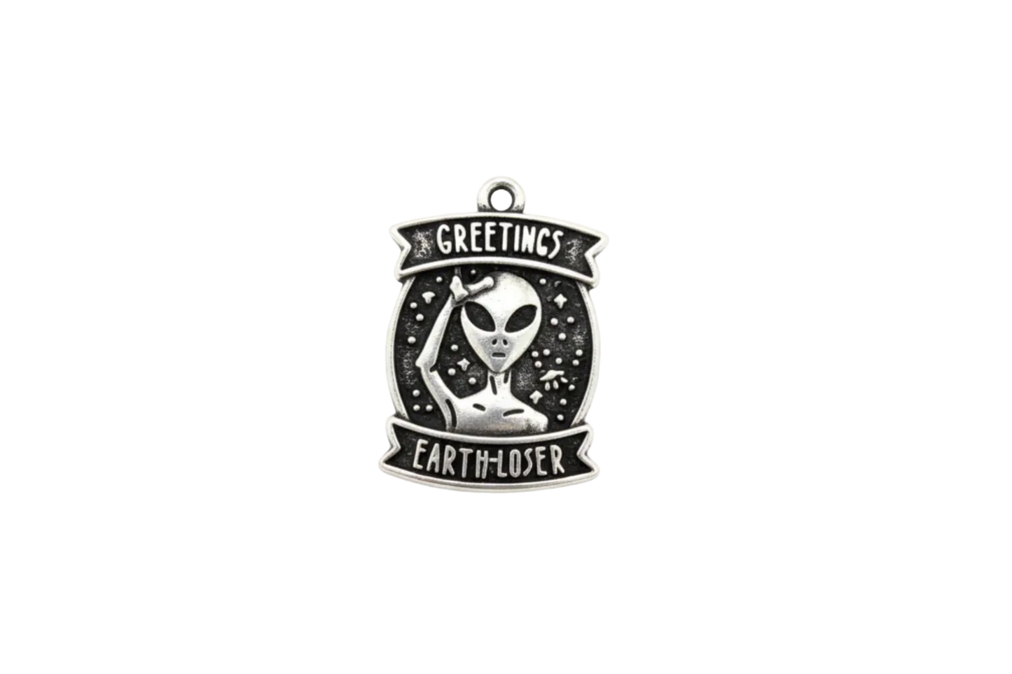 Antique silver alien badge with black background and banner text