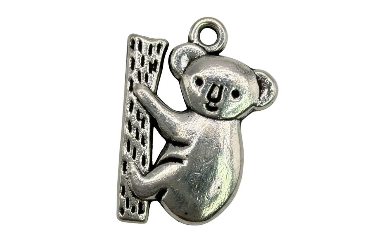 Oxidized silver koala clinging to a textured tree trunk charm