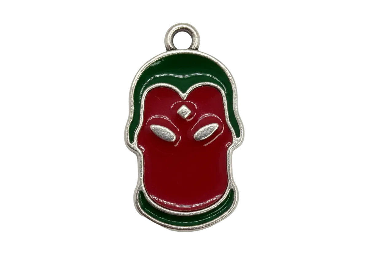 Glossy red apple motif with green accents and a small clear square gem, silver outline