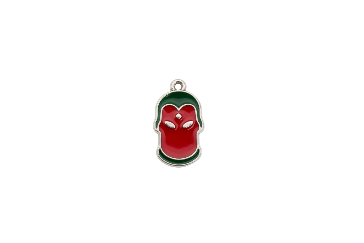 Red apple with green accents and clear square gem, silver outline