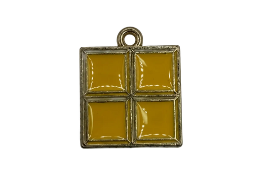 Gold-framed square tile charm with four glossy mustard enamel panels