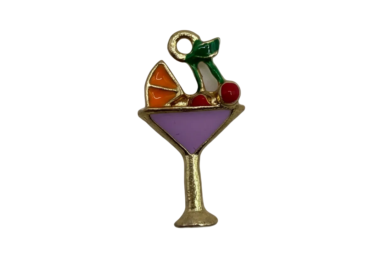 Gold-edged cocktail glass with purple enamel drink and orange, red, and green garnish details
