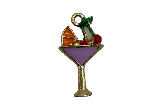 Gold-edged cocktail glass with purple enamel drink and orange, red, and green garnish details
