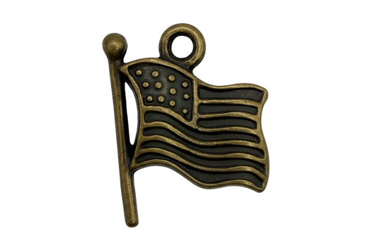 Antique gold waving stars-and-stripes flag charm with black enamel detailing