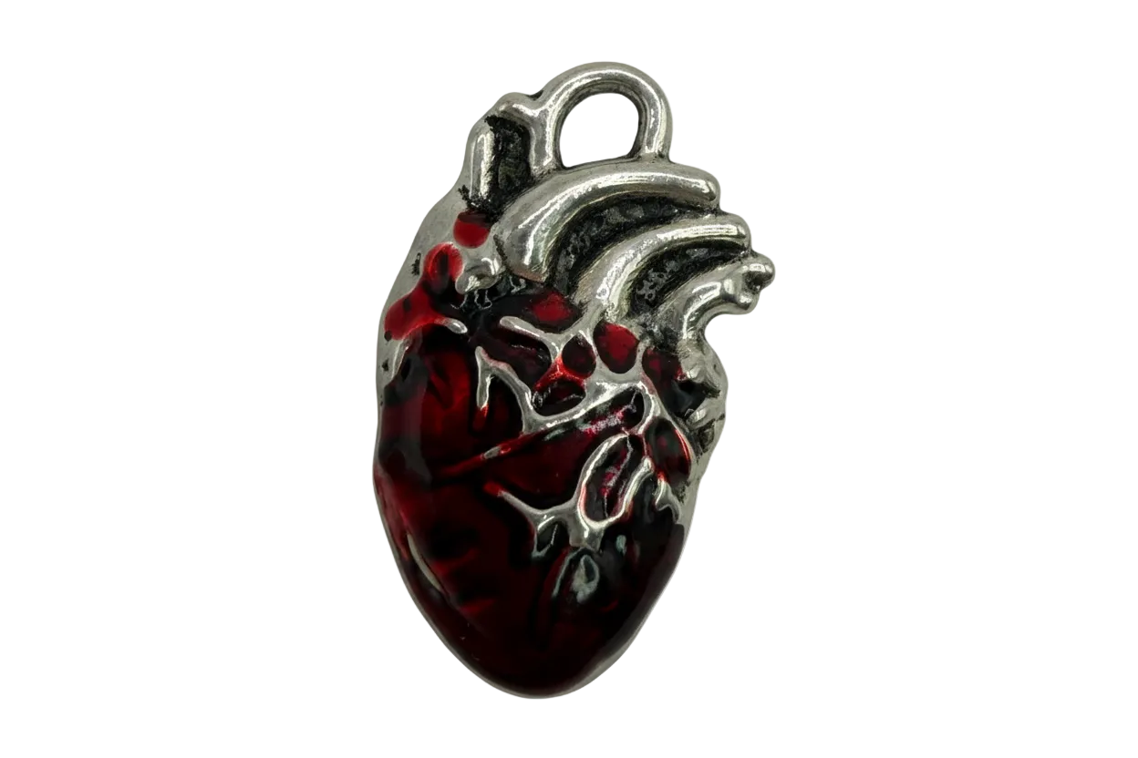 Dark red anatomical heart charm with silver-toned detailing and glossy finish
