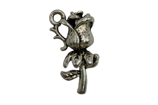 Antique silver rosebud flower charm with textured petals and oxidized detail