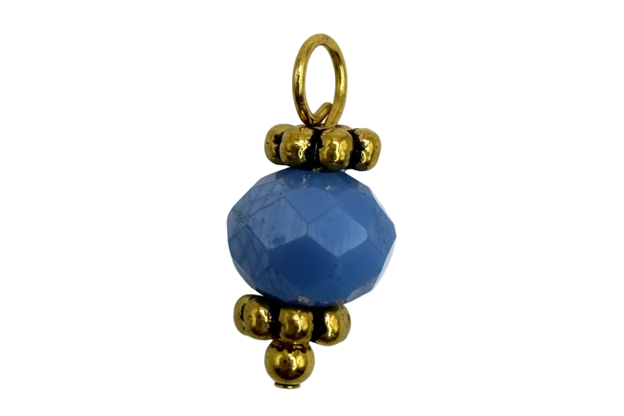 Faceted cobalt blue round gem bead with polished gold accents