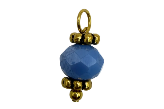 Faceted cobalt blue round gem bead with polished gold accents