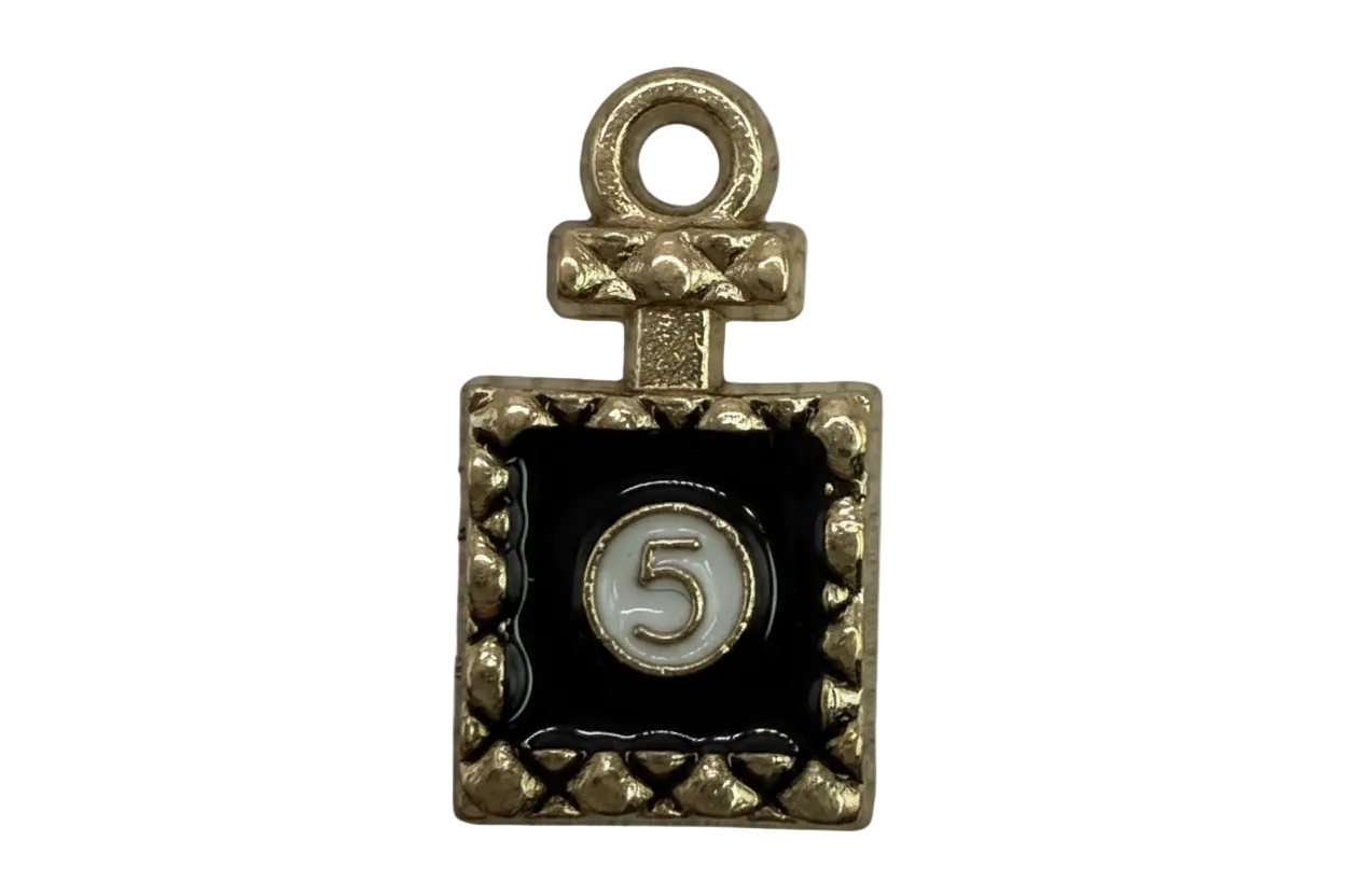 Gold rectangular plaque with black enamel and a white circle showing the number 5