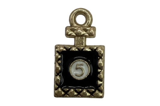Gold rectangular plaque with black enamel and a white circle showing the number 5