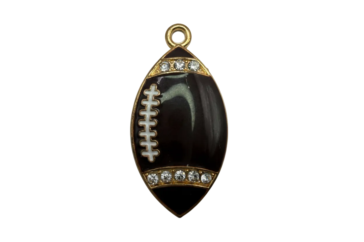 Black football charm with gold trim, white laces, and clear crystal accents