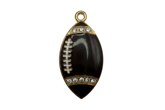Black football charm with gold trim, white laces, and clear crystal accents