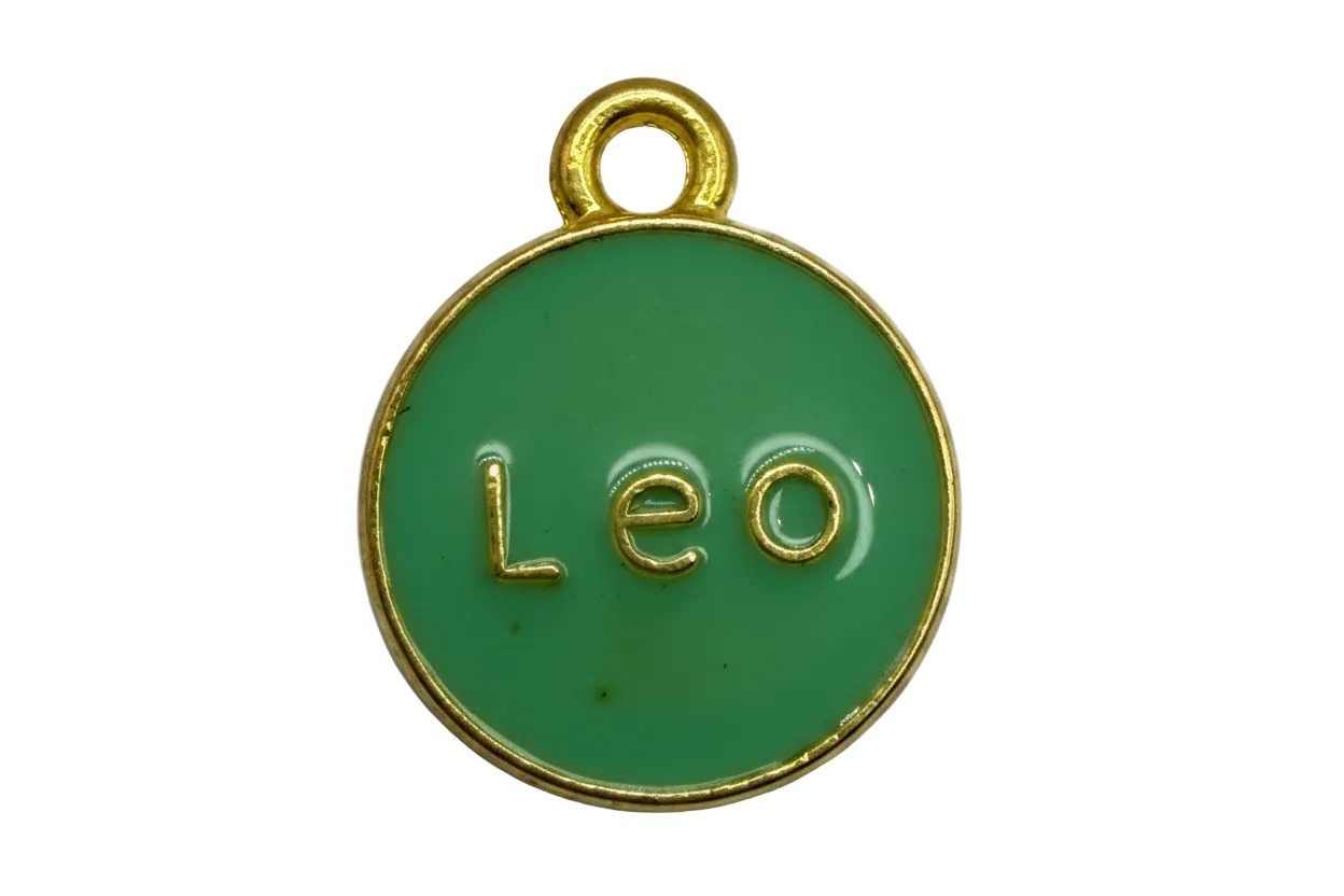Round green enamel Leo disc with raised gold lettering and gold rim