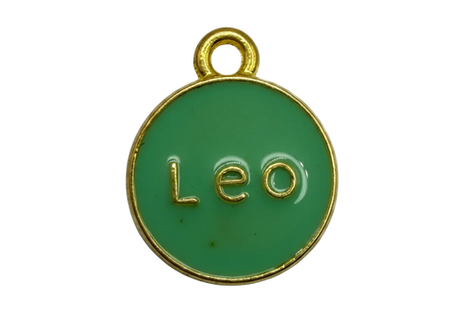 Round green enamel Leo disc with raised gold lettering and gold rim