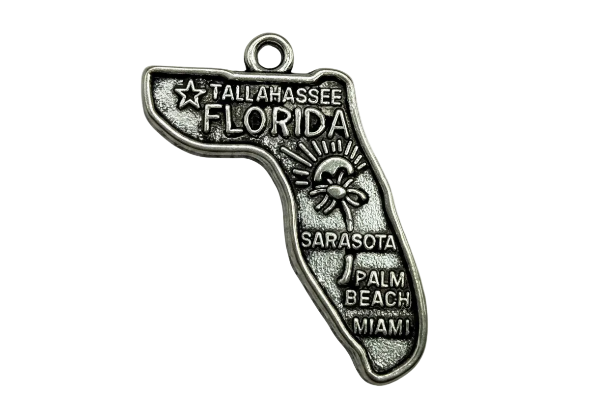 Antiqued silver Florida state map charm with raised city names and sun-and-palm detail